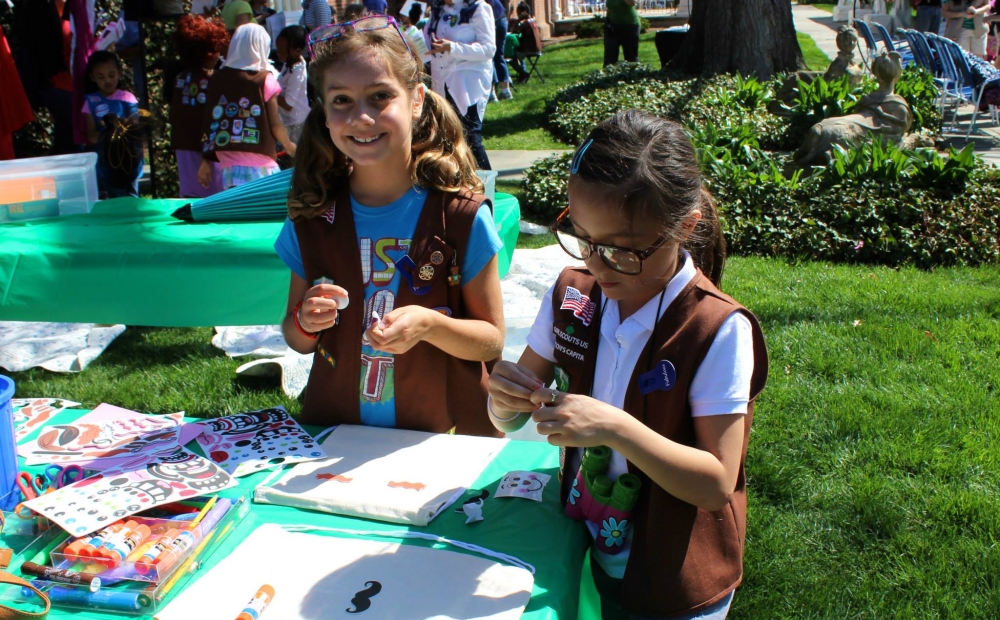 Girl Scouts working on art project outdoors
