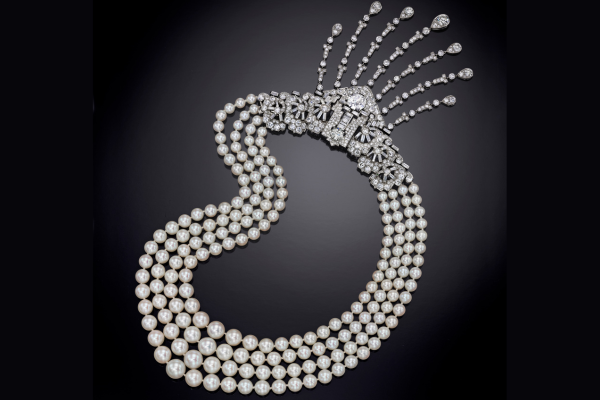 Image of a pearl necklace with diamond ornaments.