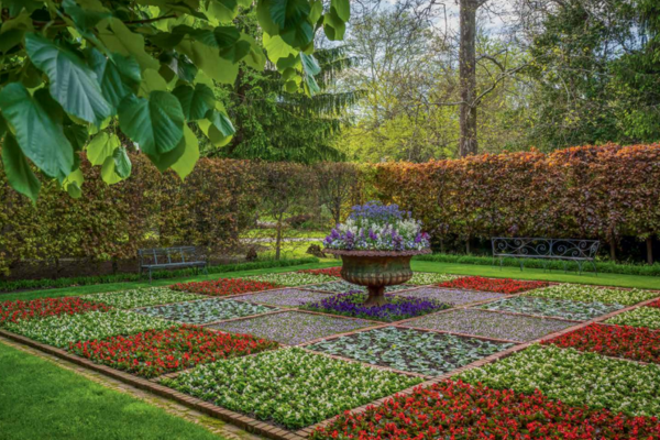 Image from Juday's book "Private Gardens of Philadelphia." The image features a large square garden, displaying different square sections of flowers in varying colors.