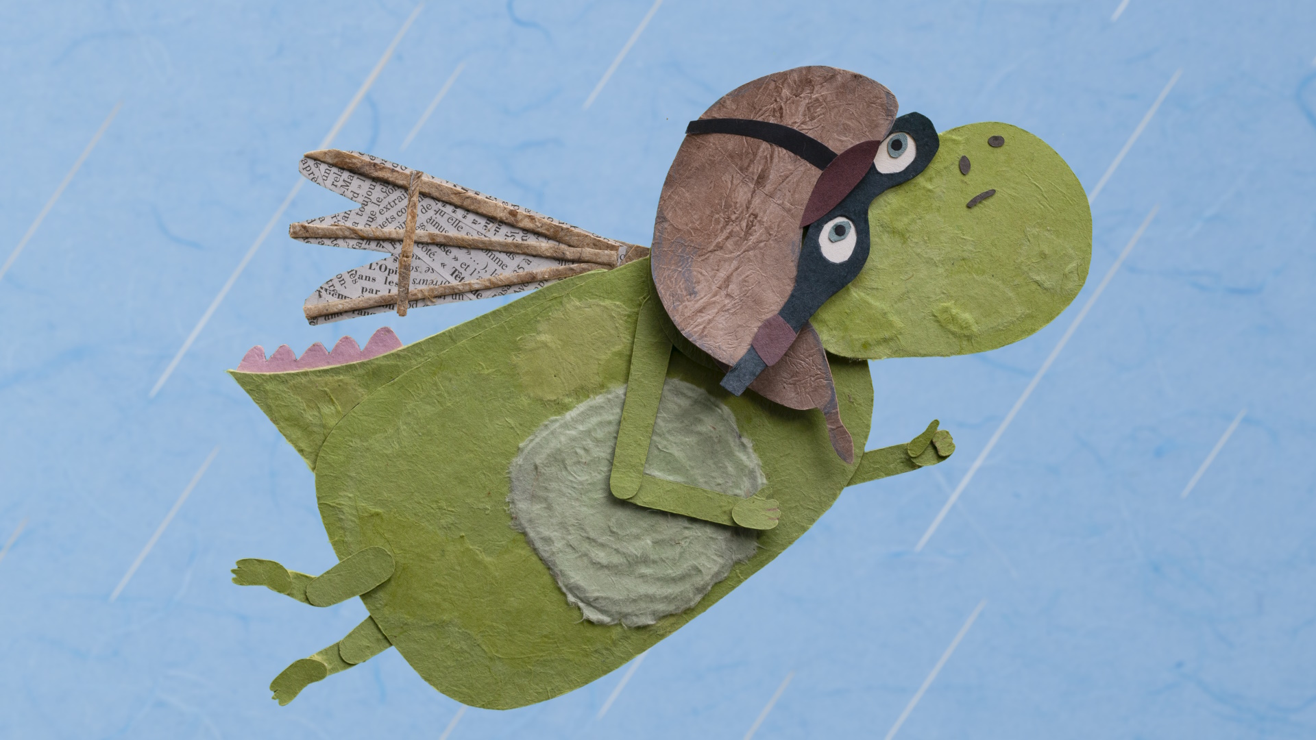 papercut illustration of a green dragon wearing a pilot helmet and goggles, flying across a blue sky