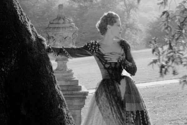 Image of Princess Natalie Paley posing with her arm resting on a tree.