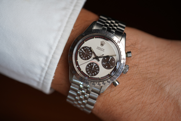 Close-up image of a Rolex wristwatch being worn on someone's wrist.