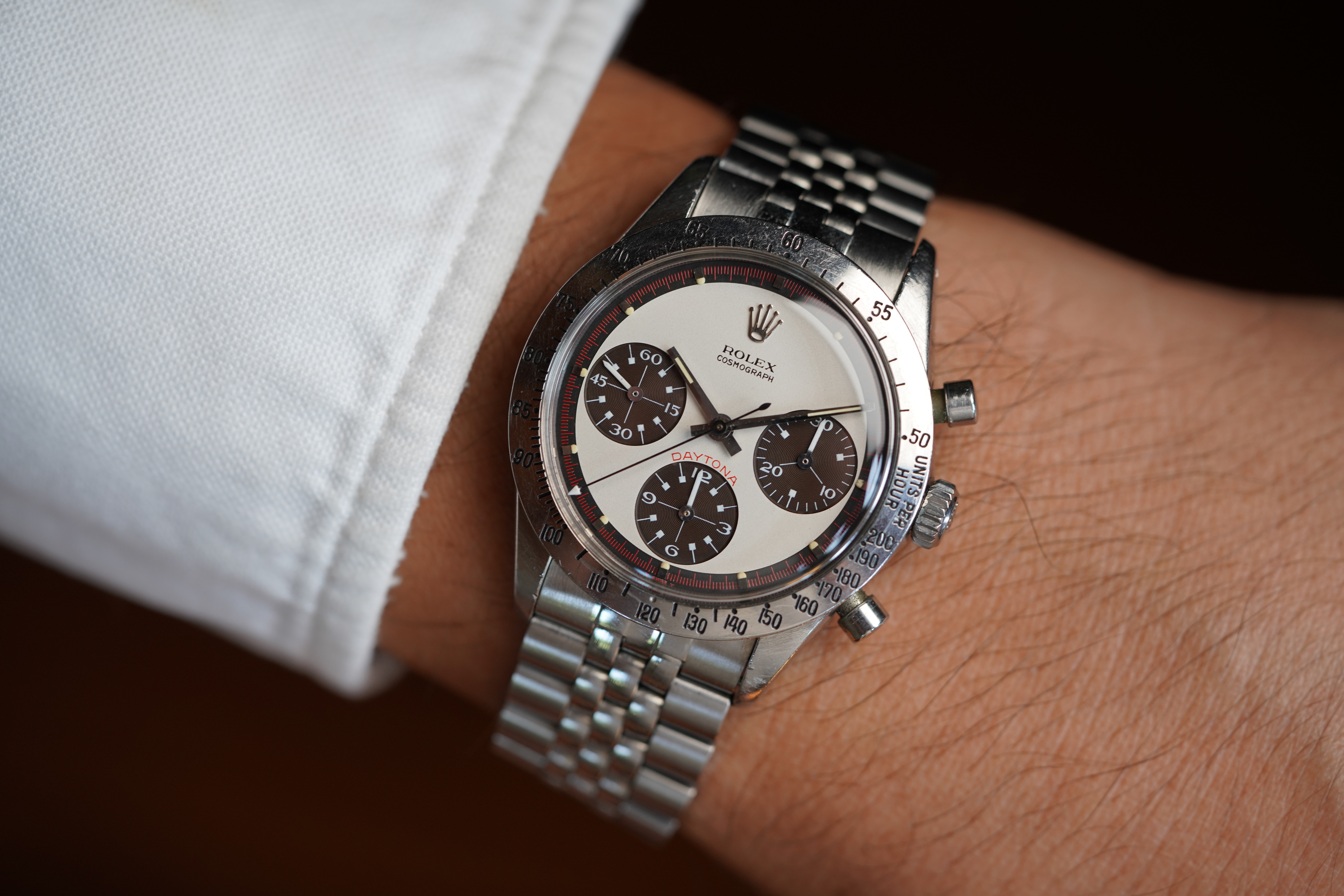 Close-up image of a Rolex wristwatch on someone's wrist.