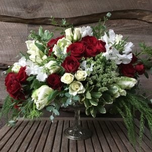 Floral arrangement featuring red roses