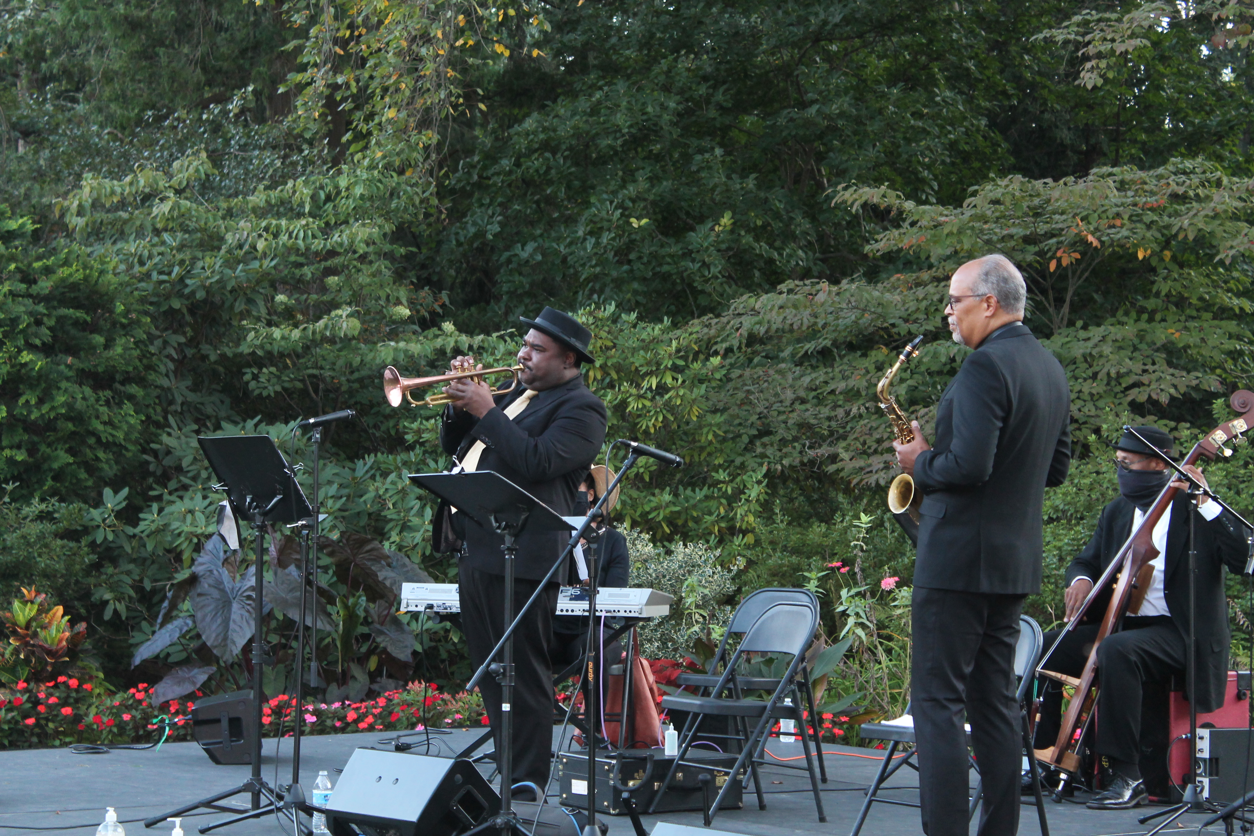 A trumpet player on stage at Jazz in the Gardens.