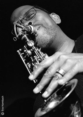 Close, black & white image of Marshall Keys playing saxaphone