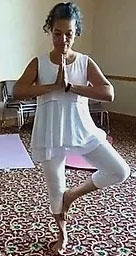 Rev. Denise Burriss performing a yoga pose