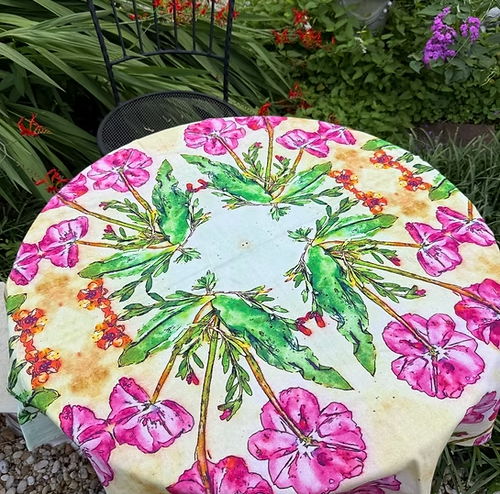 Limited edition tablecloth on a table, featuring colorful flowers