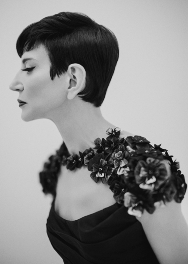 Headshot of Amy Fine Collins; she is pictured here in a black-and-white photo, displaying her side profile.