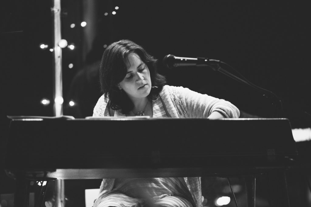 Image of Amy K Bormet playing the piano.