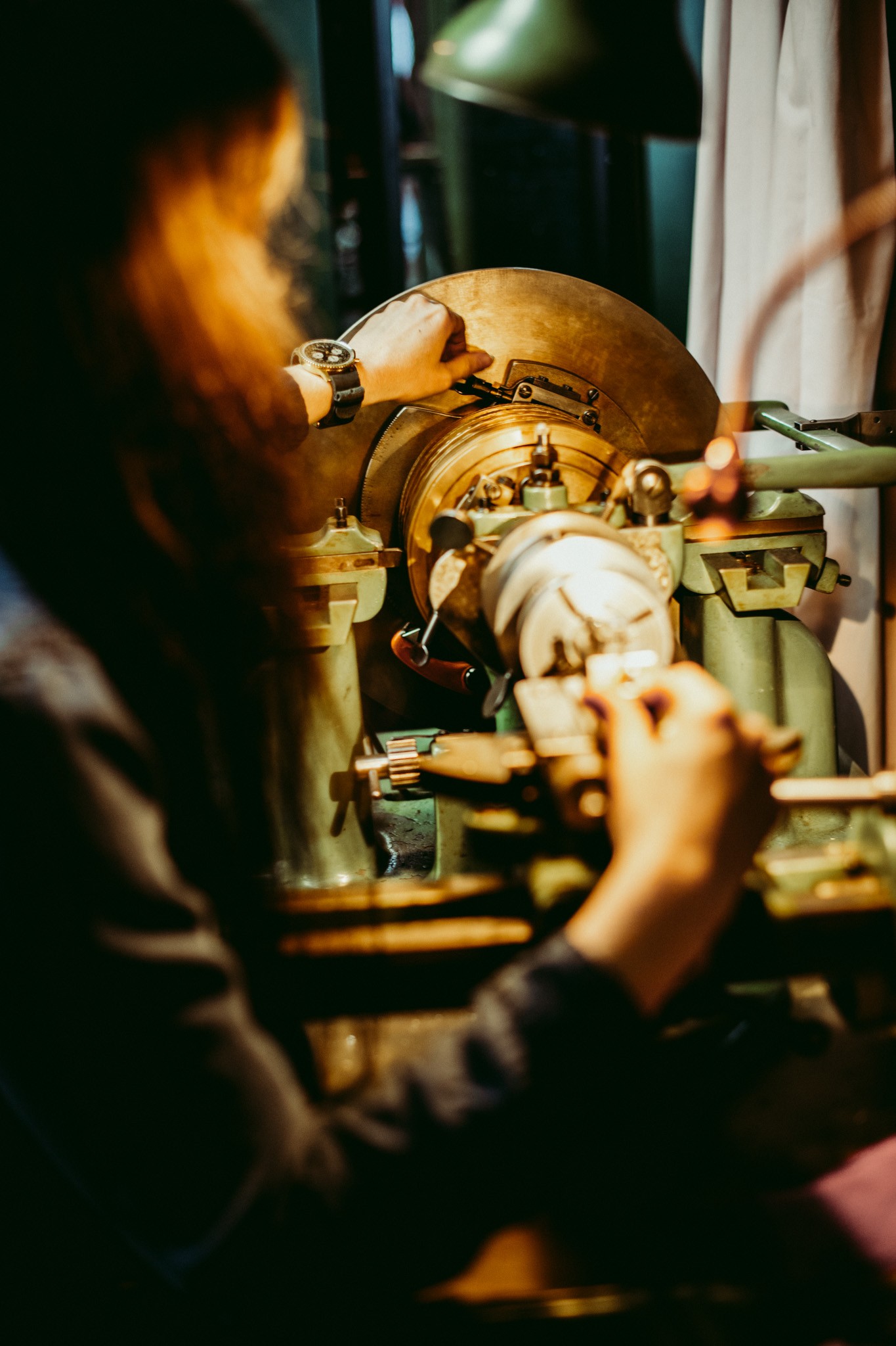 Image of Brittany Cox working on a clock.