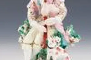 FIGURINE OF A BAGPIPER, ONE OF TWO