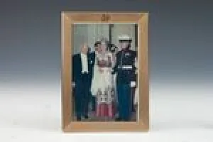 FRAME WITH PHOTOGRAPH OF MARJORIE MERRIWEATHER POST AT A RED CROSS BALL