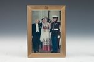 FRAME WITH PHOTOGRAPH OF MARJORIE MERRIWEATHER POST AT A RED CROSS BALL