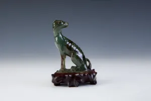 FIGURINE OF A DOG (ONE OF TWO)