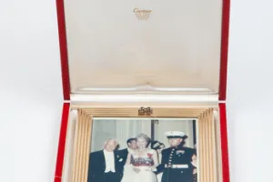 FRAME WITH PHOTOGRAPH OF MARJORIE MERRIWEATHER POST AT A RED CROSS BALL