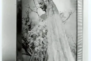 FRAME WITH WEDDING PHOTOGRAPH OF DINA MERRILL