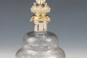 LARGE GLASS BOTTLE WITH STOPPER FROM A DRESSING TABLE SET (ONE OF TWO)