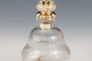 SMALL GLASS BOTTLE WITH STOPPER FROM A DRESSING TABLE SET (ONE OF TWO)
