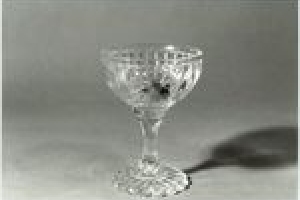 CHAMPAGNE GLASS FROM THE BANQUETING SERVICE, ONE OF TWO