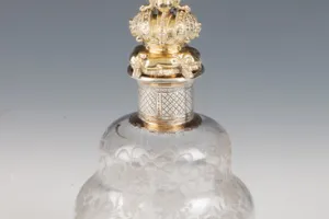 SMALL GLASS BOTTLE WITH STOPPER FROM A DRESSING TABLE SET (ONE OF TWO)