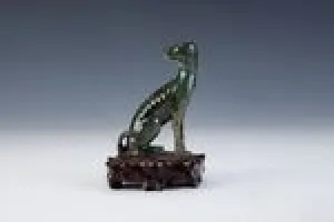 FIGURINE OF A DOG (ONE OF TWO)