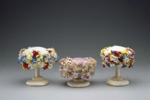 PINK BUBBLE TOQUE COVERED IN ARTIFICIAL FLOWERS