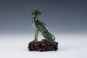 FIGURINE OF A DOG (ONE OF TWO)