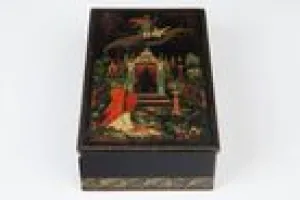 BOX WITH A SCENE OF A MAN AND WOMAN ON A FLYING CARPET