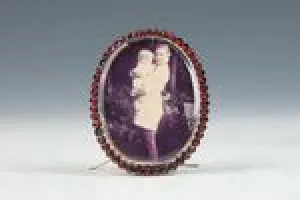 FRAME WITH A PHOTOGRAPH OF POST FAMILY MEMBERS