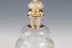 SMALL GLASS BOTTLE WITH STOPPER FROM A DRESSING TABLE SET (ONE OF TWO)