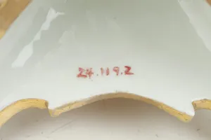 FOOTED DISH WITH BASKETWORK FROM A DESSERT SERVICE, ONE OF THREE