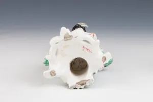 FIGURINE OF A BAGPIPER, ONE OF TWO