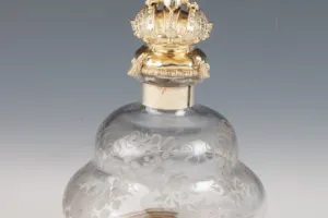 LARGE GLASS BOTTLE WITH STOPPER FROM A DRESSING TABLE SET (ONE OF TWO)
