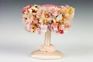 PINK BUBBLE TOQUE COVERED IN ARTIFICIAL FLOWERS