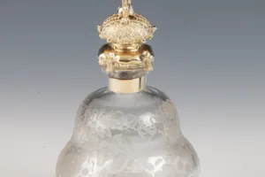 SMALL GLASS BOTTLE WITH STOPPER FROM A DRESSING TABLE SET (ONE OF TWO)