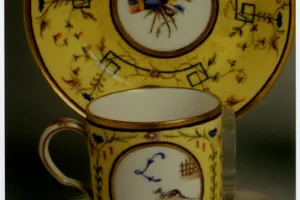 SAUCER WITH REBUS (SOUCOUPE), ONE OF TWO