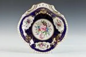 SHELL-SHAPED DISH FROM A DINNER SERVICE