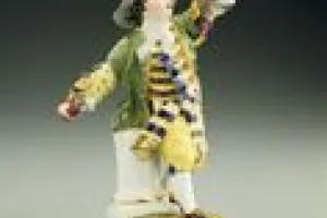 BOY PLAYING WITH GARLAND OF FLOWERS