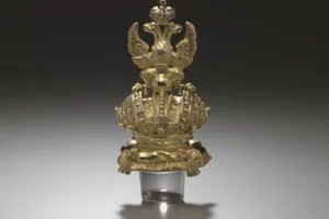 LARGE GLASS BOTTLE WITH STOPPER FROM A DRESSING TABLE SET (ONE OF TWO)