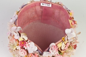 PINK BUBBLE TOQUE COVERED IN ARTIFICIAL FLOWERS