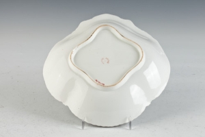 SHELL-SHAPED DISH FROM A DINNER SERVICE