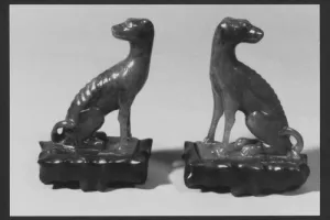 FIGURINE OF A DOG (ONE OF TWO)