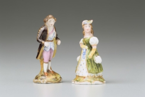 FIGURINE OF A YOUNG WOMAN, ONE OF A PAIR