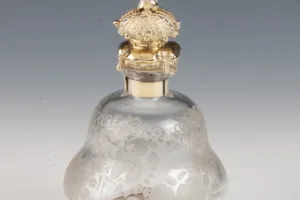 SMALL GLASS BOTTLE WITH STOPPER FROM A DRESSING TABLE SET (ONE OF TWO)