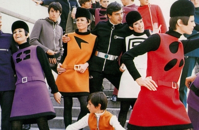Large group of models in brightly colored mod shift jackets and track suits  designed by Pierre Cardin