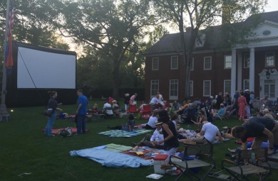 Hillwood's mansion is the backdrop for revelers picnicking on the Lunar Lawn before an outdoor film