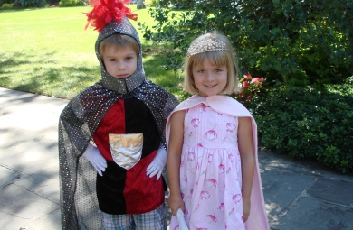 children wearing knight and princess costumes