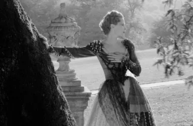 Image of Princess Natalie Paley posing with her arm resting on a tree.