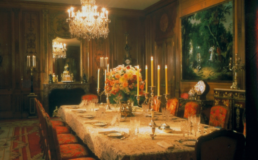 The Dining Room table is set with Marjorie Merriweather Posts services